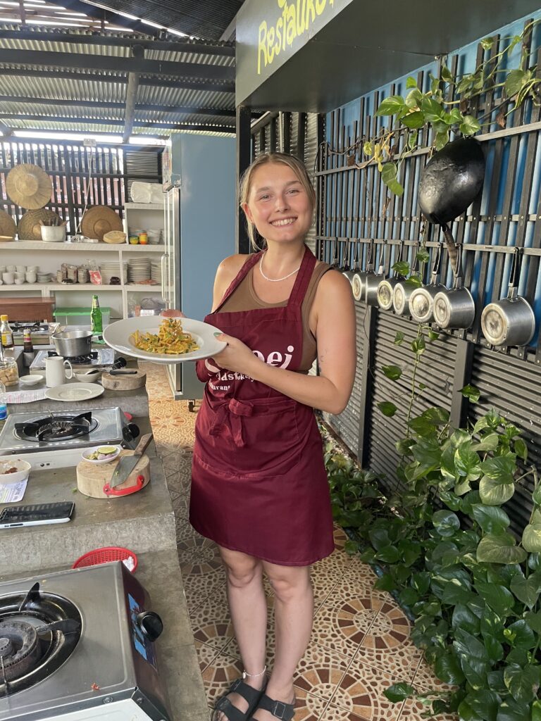 A girl holding a plate of food