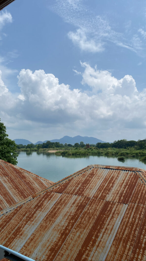 Orange roofs in front of body of water